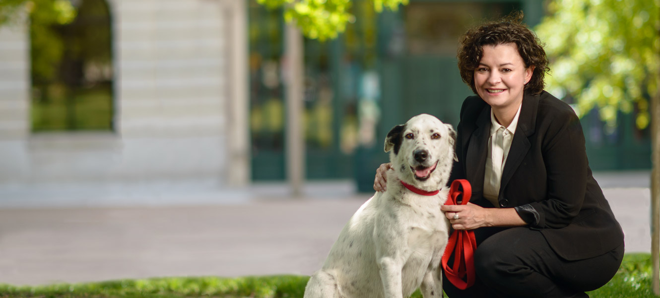 Lucie Brackin with her dog in park