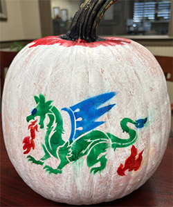 Pumpkin entry #1 - white pumpkin with a stenciled dragon in red, green and blue