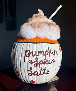 Pumpkin entry #2 - decorated to look like Pumpkin Spice latte with white cotton balls at the top and a straw coming out of the cotton.